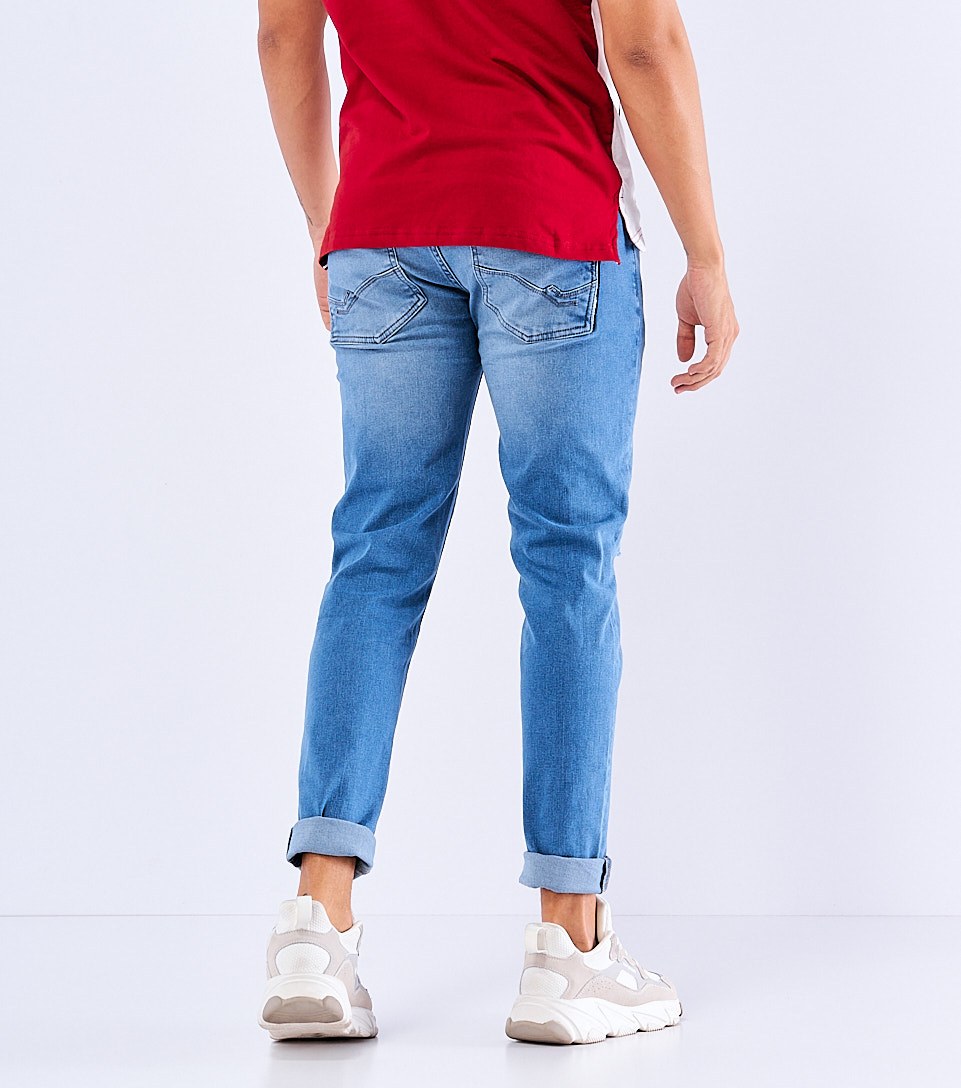 Jean Para Hombre Con Proceso Claro Y Rotos En Piernas Con Grafias Unser 829039 AZ